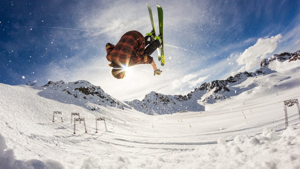 Man Doing Front Flip While Skiing
