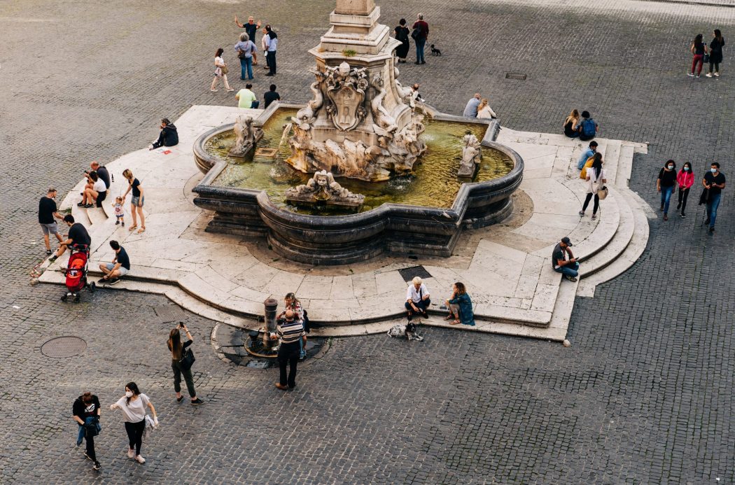 gathering around a piazza to study Italian in italy