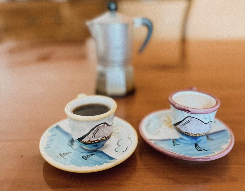 two coffees and a moka on the table is living in italy worth it