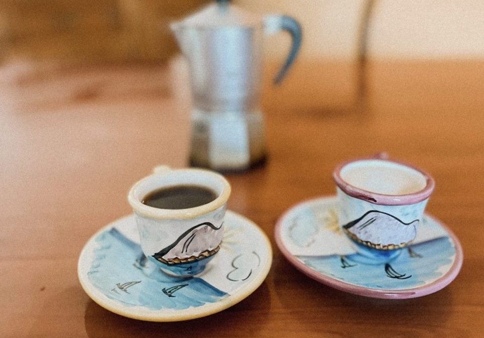 two coffees and a moka on the table is living in italy worth it
