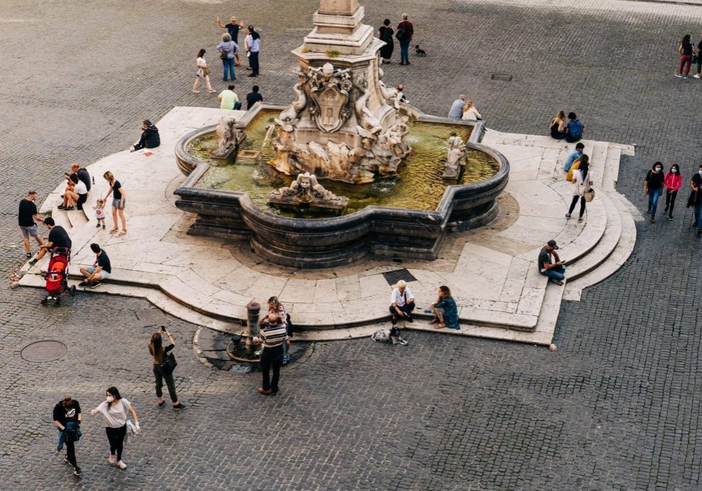 gathering around a piazza to study Italian in italy