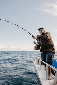 Client fishing with Reef Encounters