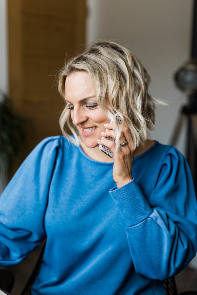 Kellie in blue on phone
